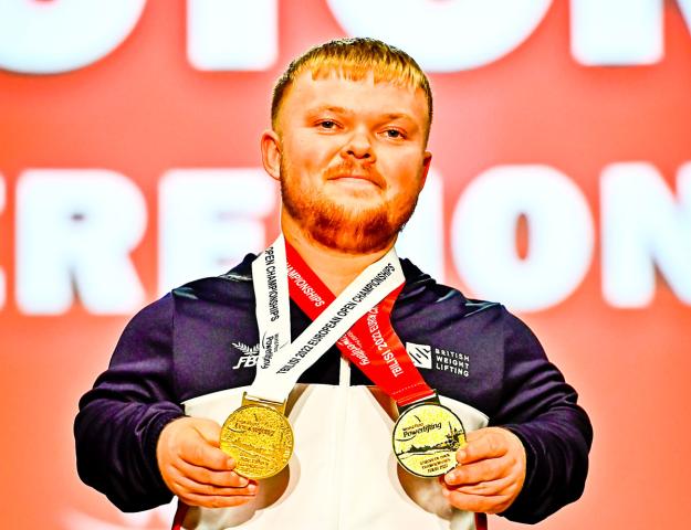 Mark holding medals