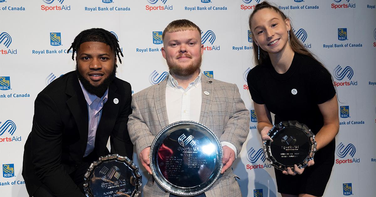 Emmanuel, Mark and Marfa holding their trophies