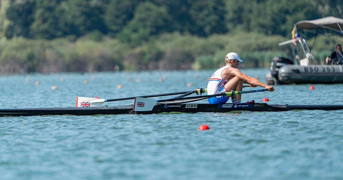 Marcus rowing on lake