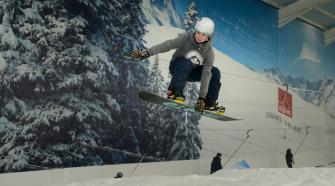 Female Snowboarder on moutain slope